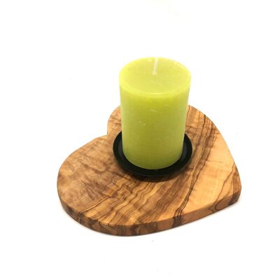 Candle holder on a base as a heart made of olive wood