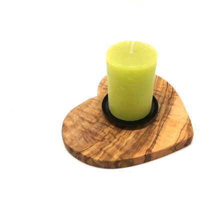 Candle holder on a base as a heart made of olive wood