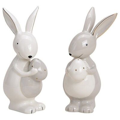 White ceramic bunny with egg