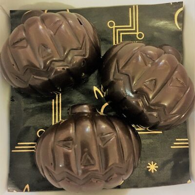 Small dark chocolate pumpkins with raspberry filling