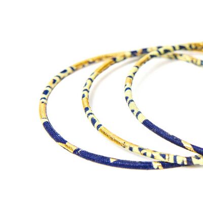 Feine Armbänder aus marineblauem und goldenem Wachs