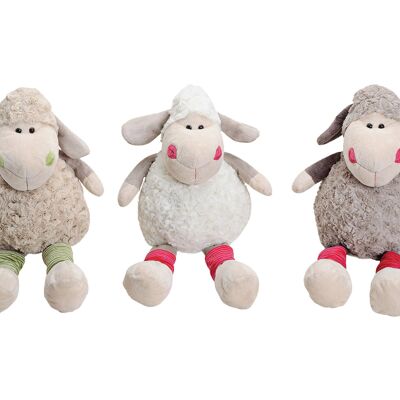 Sitting sheep made of plush