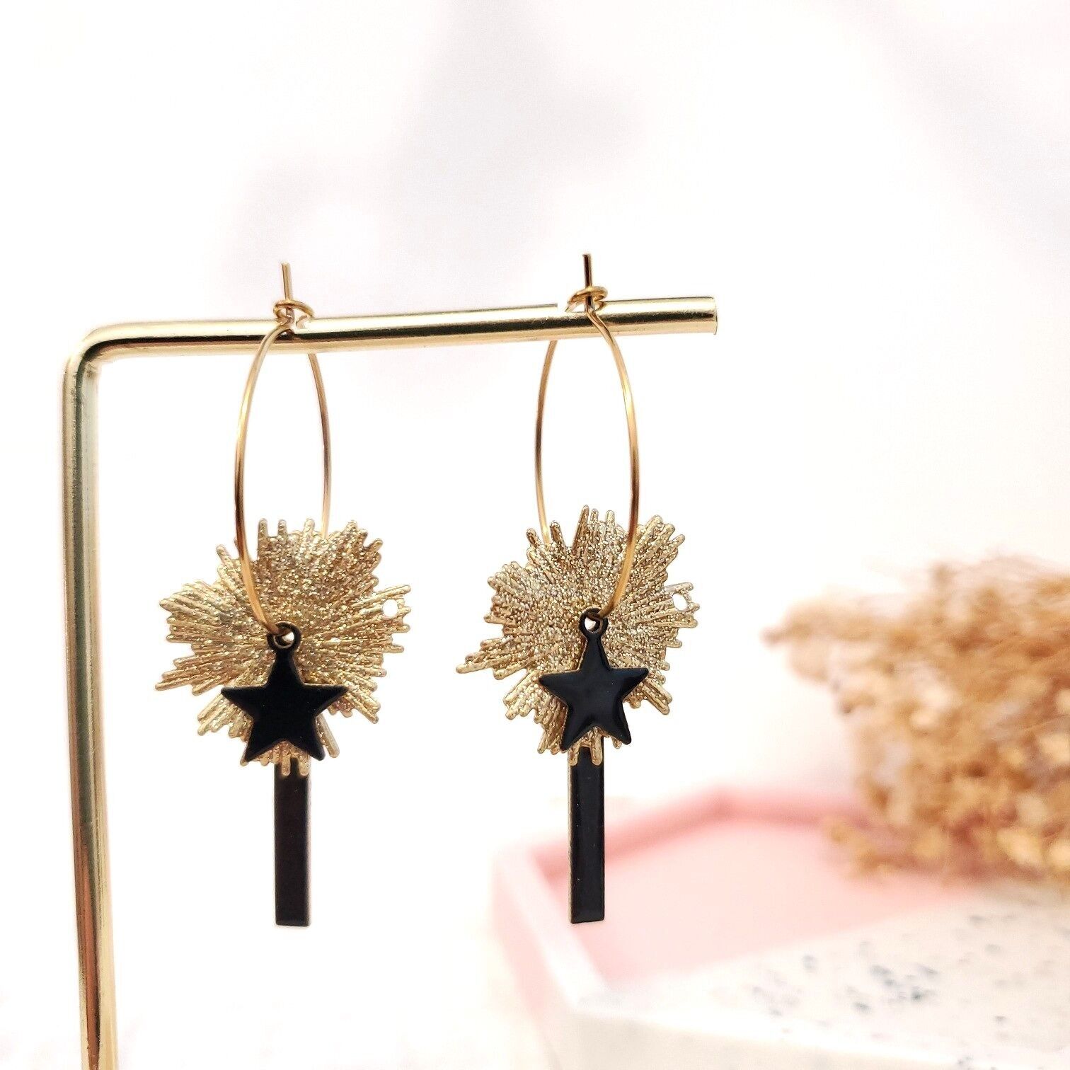 Orecchini a cerchio con stella solare