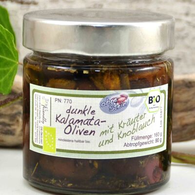 Black organic pitted olives with herbs and garlic in olive oil - Greece Kalamata