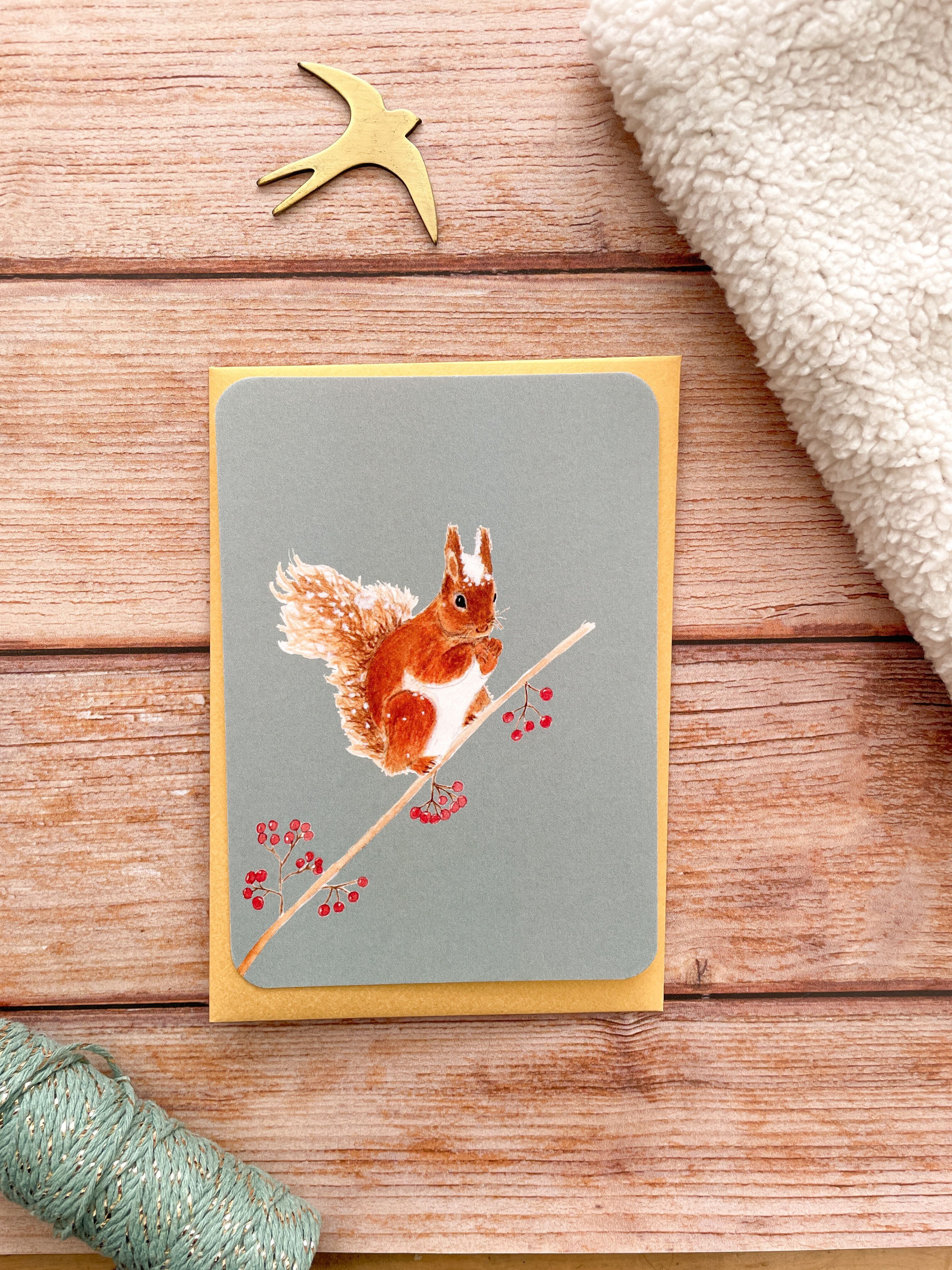 cartolina di scoiattolo e bacche