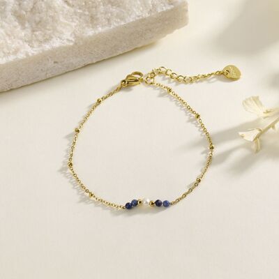 Gold chain bracelet with blue beads