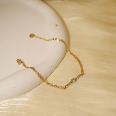 Double gold chain bracelet with rhinestone bar
