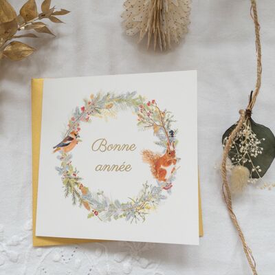 Cartolina d'auguri dorata di felice anno nuovo - corona di scoiattolo
