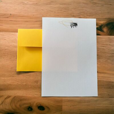 Compendio de papel de escribir con líneas de remolino de abejas