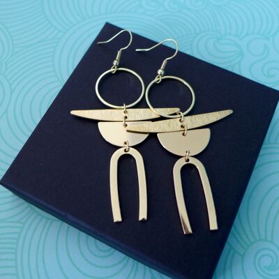 Contemporary design earrings in raw golden brass