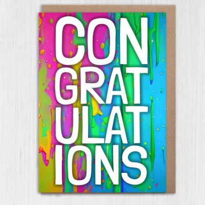 Carte de félicitations avec des éclaboussures de peinture arc-en-ciel colorée
