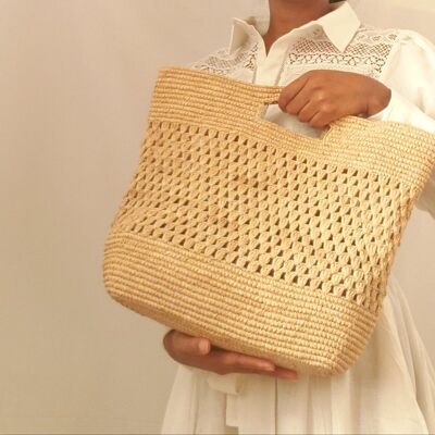 Hive raffia bag, carried in the hand