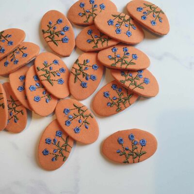 Orange embroidered hair clips