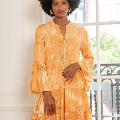 Mid-length dress printed in gold, with lace detail