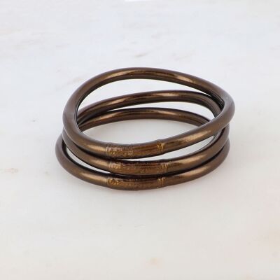 Bracciale buddista spesso in cioccolato fondente con un mantra inciso "Felicità, fortuna, fortuna e amore" in tailandese