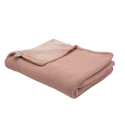 Vecchia coperta lavorata a maglia rosa