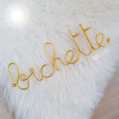 Word "bichette" in gold thread