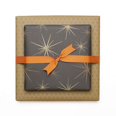 "Starburst" wrapping paper with golden yellow star ornaments against a brown background - printed on both sides on 100% recycled paper