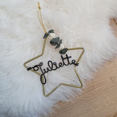 Personalized golden Christmas star with dried flowers