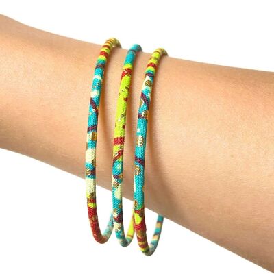 Fine bracelets in turquoise, anise, red and gold African wax