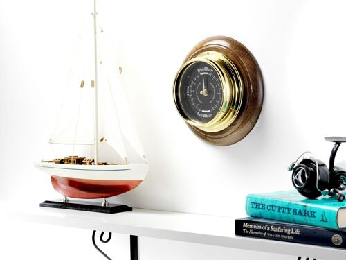 Handmade Prestige Tide Clock in Solid Brass With a Jet Black Aluminium Dial, mounted on a solid English Dark Oak Wall Mount