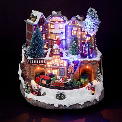 Illuminez la scène du village de Noël avec un train en mouvement et de la fibre optique