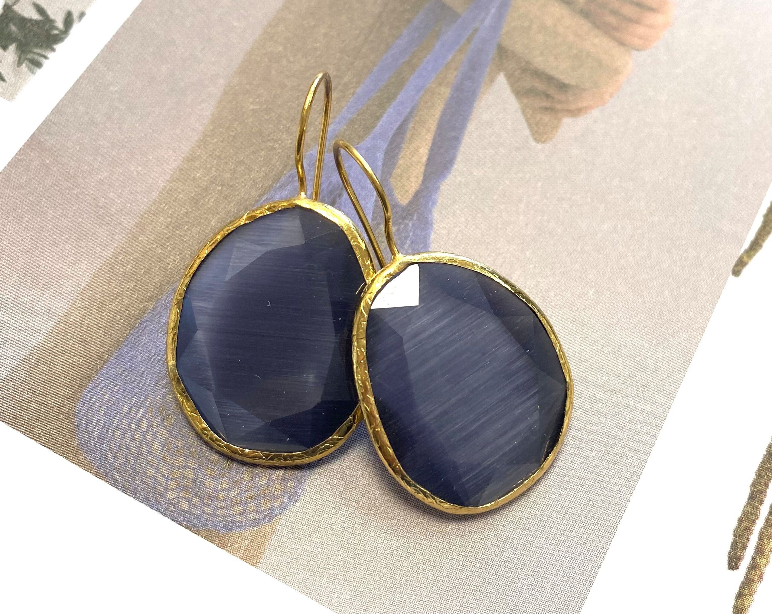 Orecchini viola cateye pietra grande