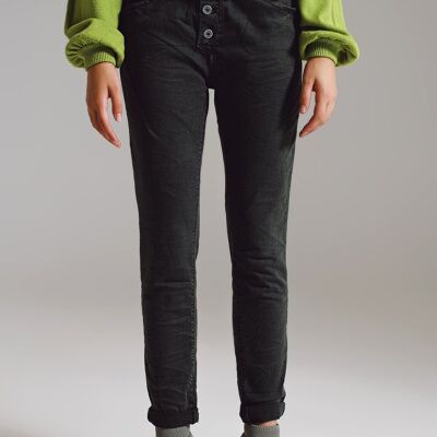 Jeans skinny con bottoni a vista in colore verde militare