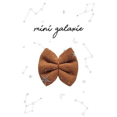 Mini pasador lazo gasa ocre estrellas plateadas