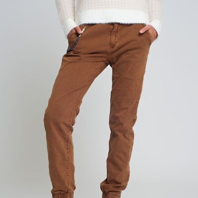 Cuffed utility pants with chain in brown