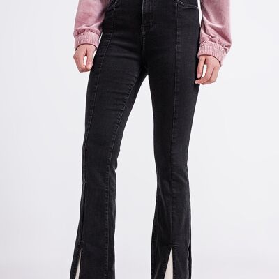 Flare black jeans with split hem