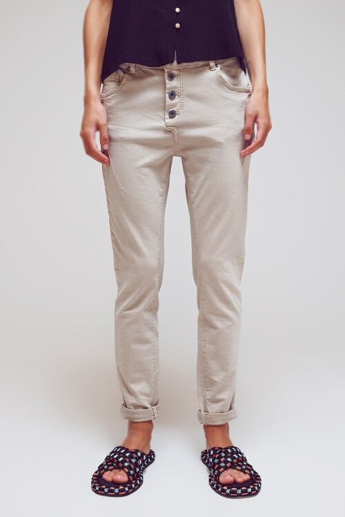 Exposed buttons skinny jeans in beige