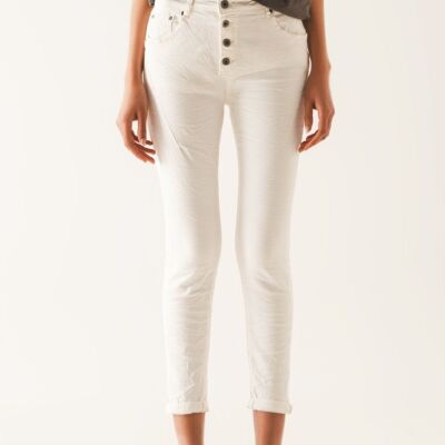Exposed buttons skinny jeans in cream