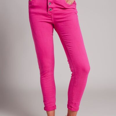 Exposed buttons skinny jeans in fuchsia