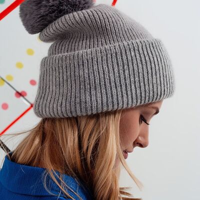 Gray knitted hat with pompom