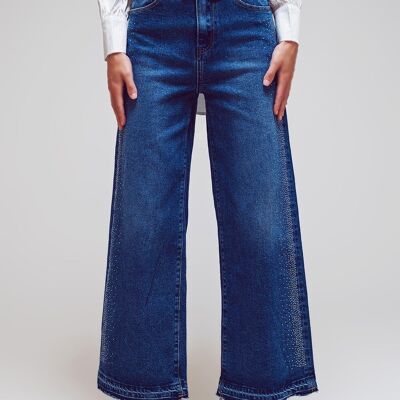 Jeans a gamba larga con dettagli in strass laterali in lavaggio medio