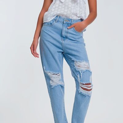 High waist mom jeans with busted knees in light denim