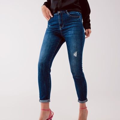 Jeans skinny strappati a vita alta in blu lavaggio medio