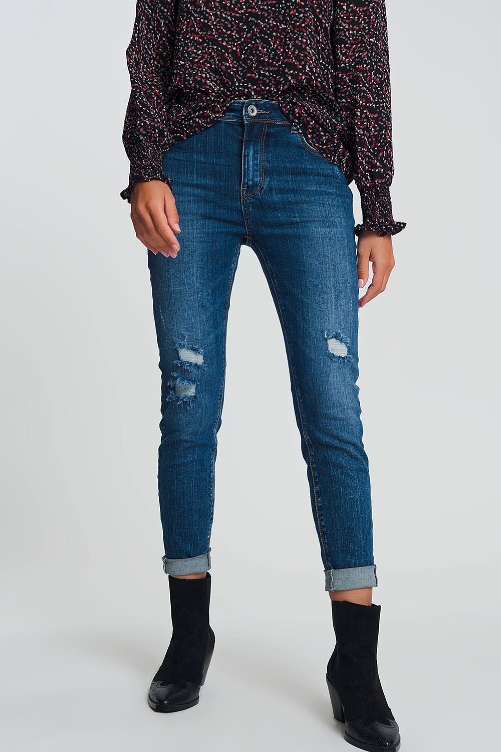 Jeans skinny a vita alta blu lavaggio scuro con dettagli strappati