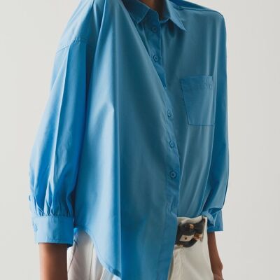 Camisa azul de popelina con manga voluminosa