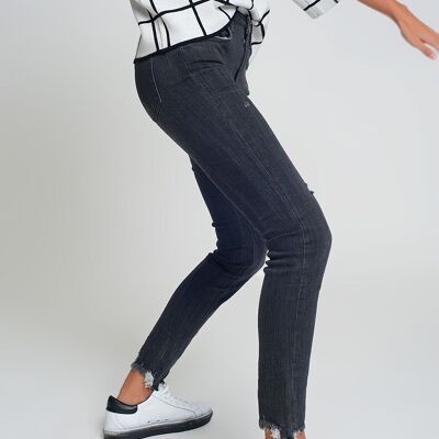 mid rise jeans in black with raw hem
