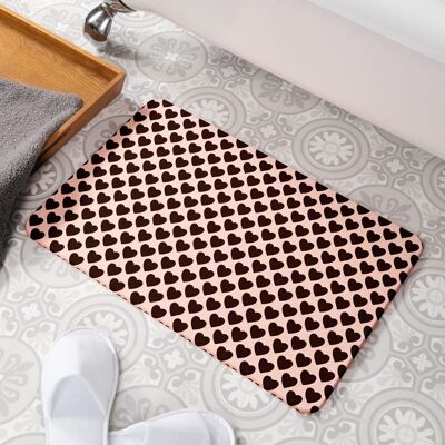 Tapis de bain antidérapant en pierre rose à motif de coeur noir