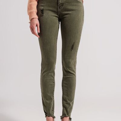 Jeans skinny strappati in verde