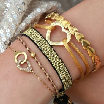 Coeurs de bracelet dorés 2