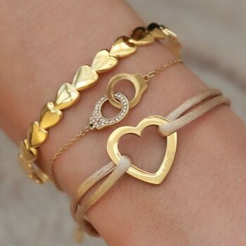 Coeurs de bracelet dorés 3