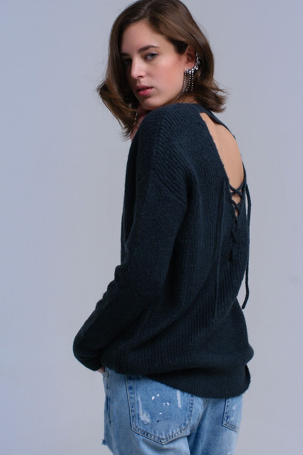 Green knitted sweater with tie-back closure