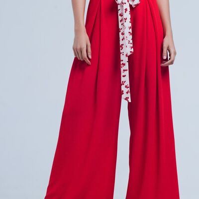 Pantaloni rossi con cintura floreale