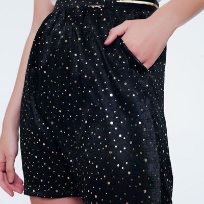 Black mini skirt with pleats in gold polka dot