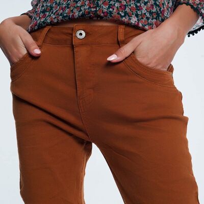 Jeans skinny con cavallo basso in arancione