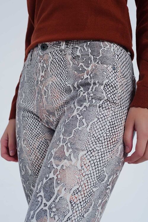 beige coloured pants with snake print